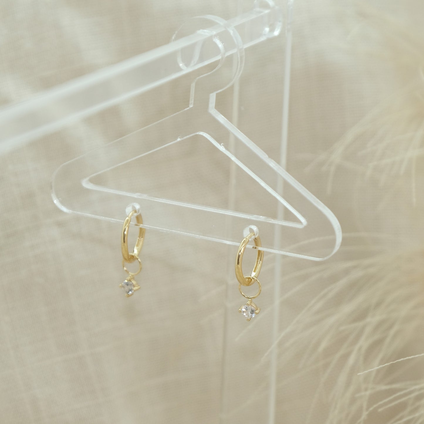 14ct White Sapphire Earring Charm from Ella Ray Jewellery: Delicate charm crafted from 14ct gold, adorned with shimmering white sapphire stones, offering a sophisticated addition to your jewellery collection.