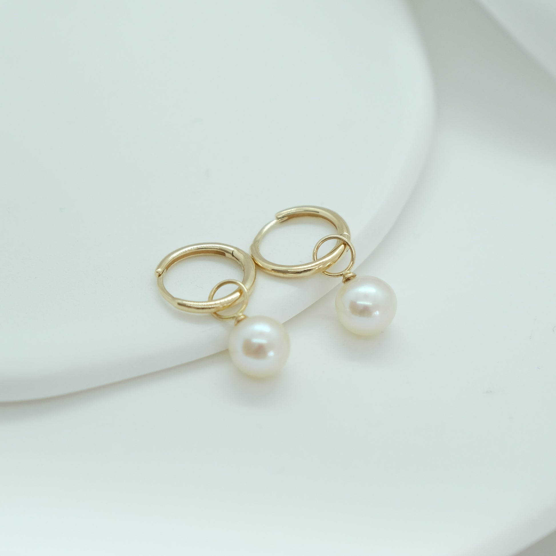 14ct Pearl Earring Charm from Ella Ray Jewellery: Sophisticated charm crafted from 14ct gold, featuring a lustrous pearl, perfect for adding timeless elegance and a touch of luxury to your earrings collection.