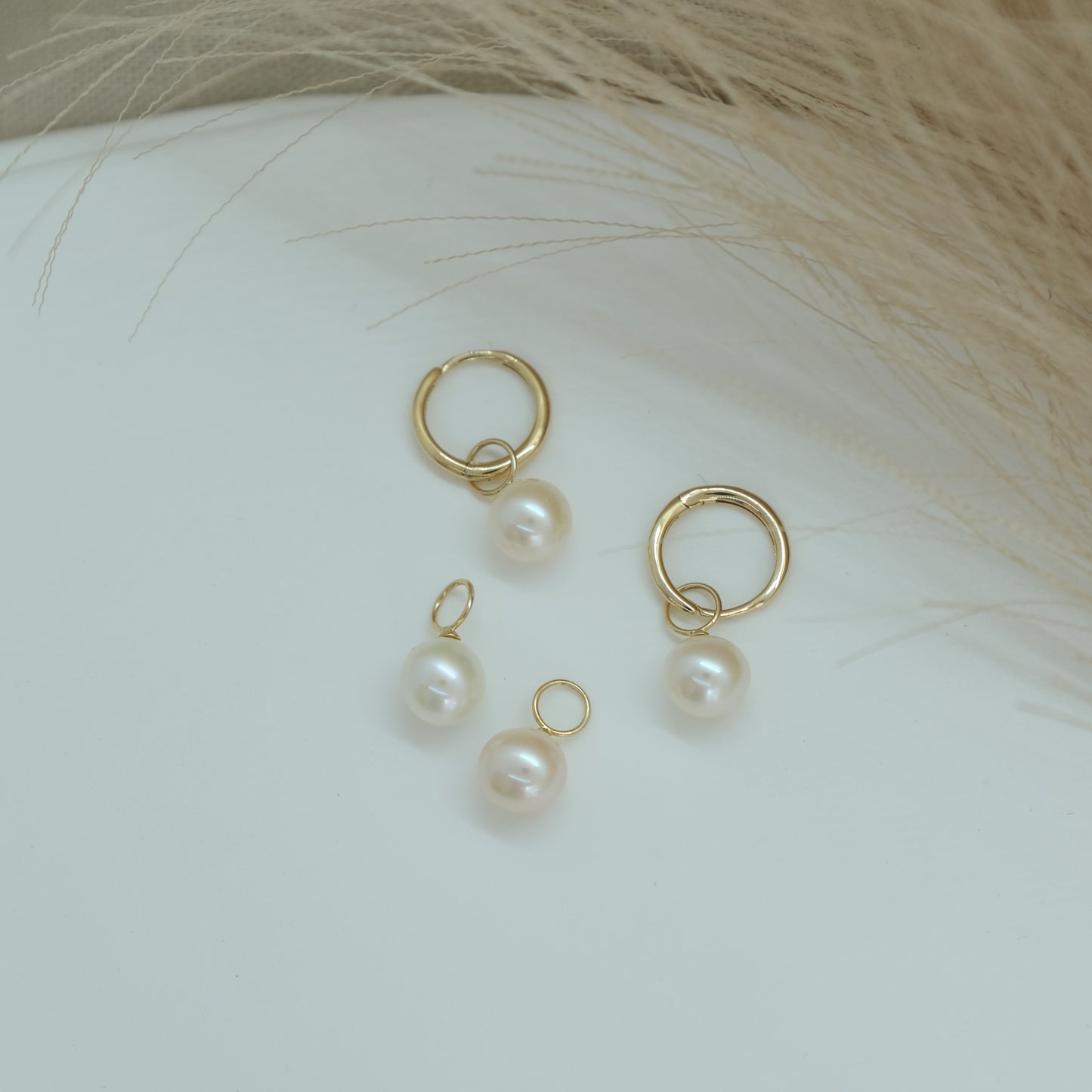 14ct Pearl Earring Charm from Ella Ray Jewellery: Sophisticated charm crafted from 14ct gold, featuring a lustrous pearl, perfect for adding timeless elegance and a touch of luxury to your earrings collection.