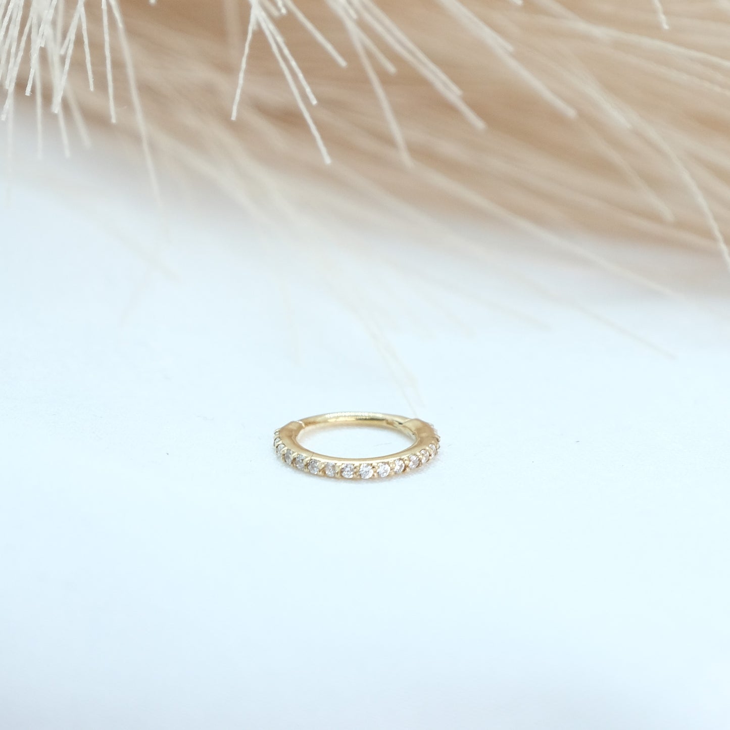 9ct Gold Pavé Gem Eternity Hinge Ring featuring a delicate band adorned with sparkling gemstones, perfect for adding elegance and shine to any outfit. Ideal for everyday wear or special occasions