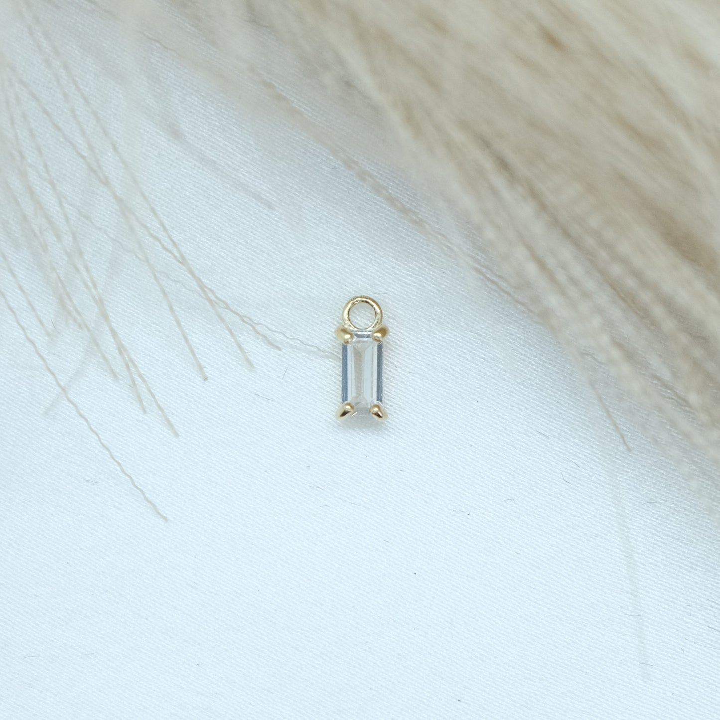 9ct Baguette Jewel Earring Charm featuring a stunning baguette-cut gemstone set in a sleek gold frame. Perfect for adding a touch of elegance and sparkle to any earring collection, ideal for both casual and formal wear.