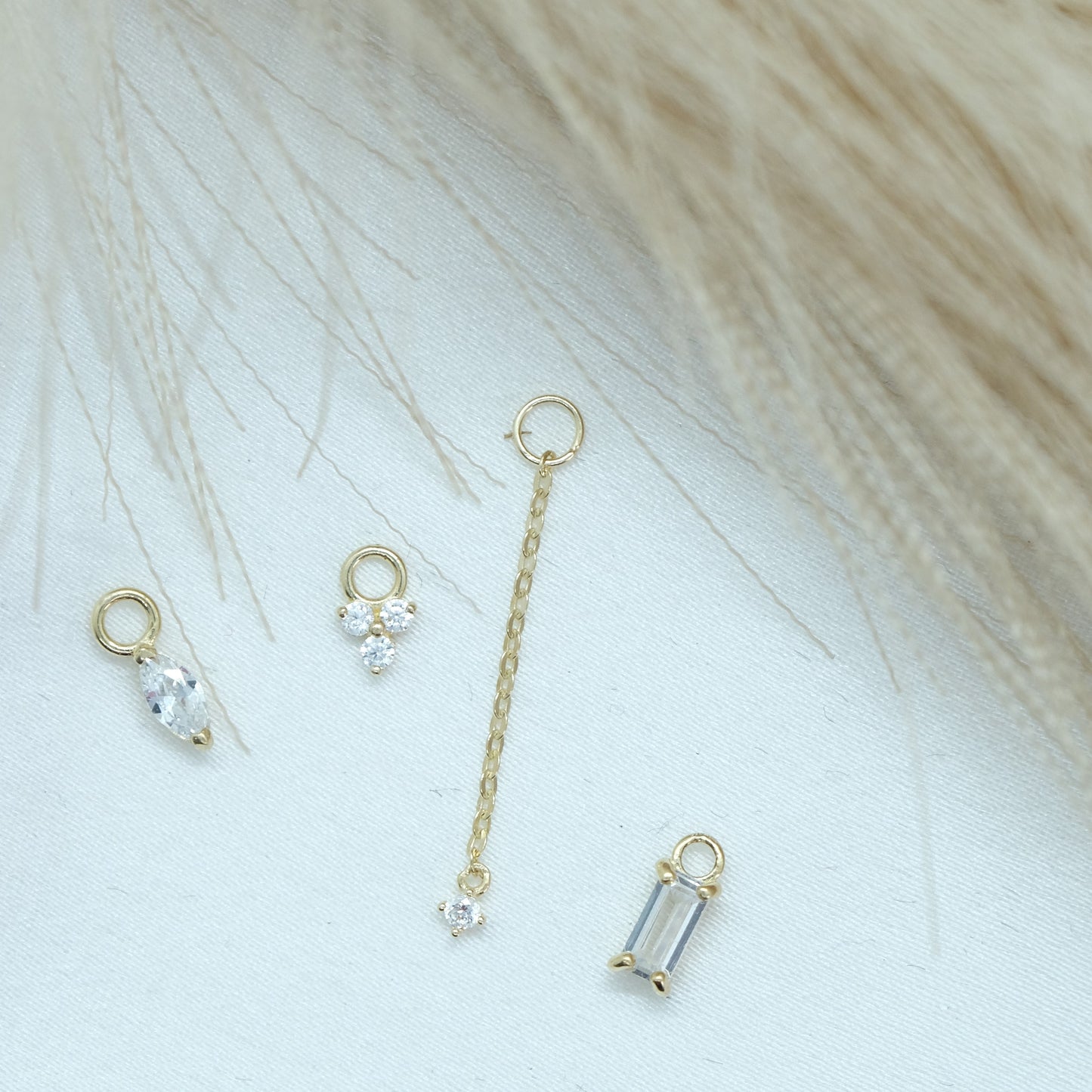 9ct Baguette Jewel Earring Charm featuring a stunning baguette-cut gemstone set in a sleek gold frame. Perfect for adding a touch of elegance and sparkle to any earring collection, ideal for both casual and formal wear.